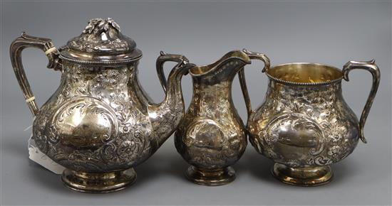 A Victorian embossed silver pear shaped three piece tea set, William Gough, Birmingham, 1863, gross 34.5 oz.